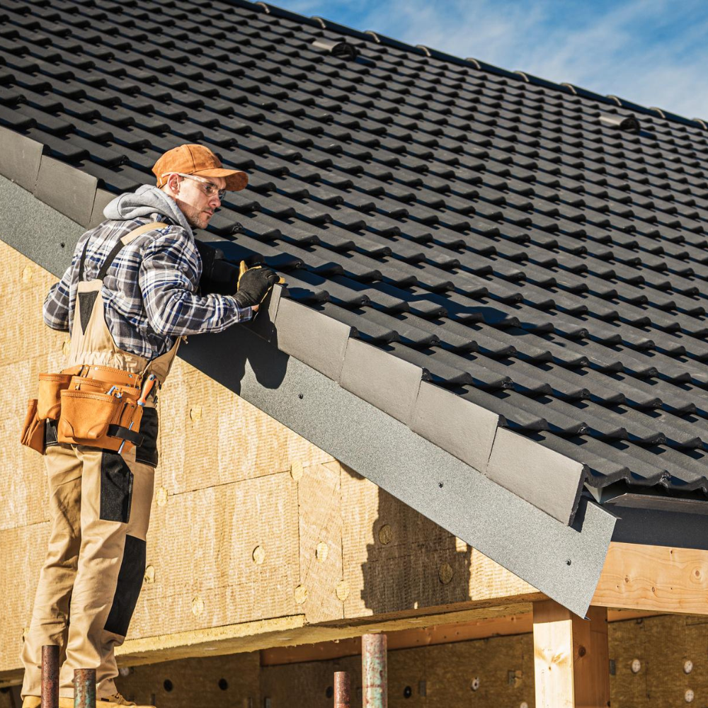 Roofer installing roof tiles on house – Dallas Roofings