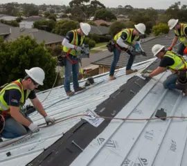 Roofers installing metal roofing system – Dallas Roofings