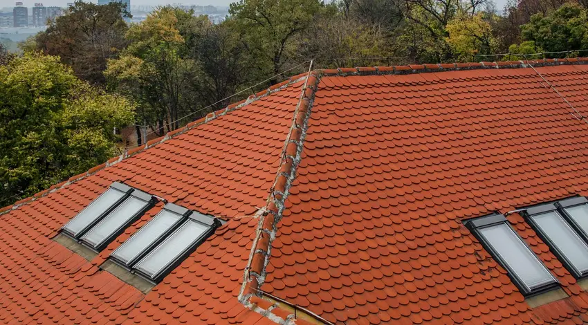 Newly installed red tile roof with skylights – Dallas Roofings
